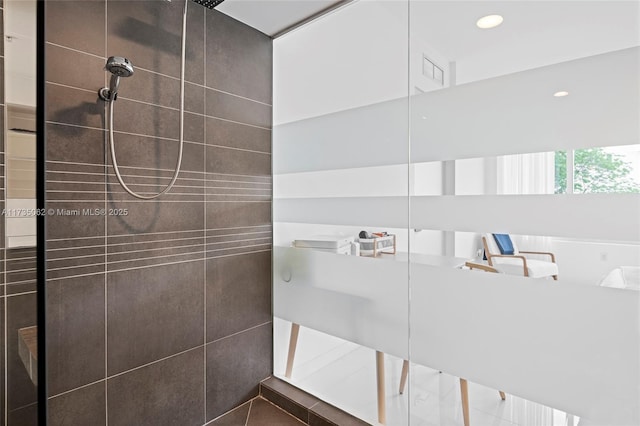 bathroom with tiled shower