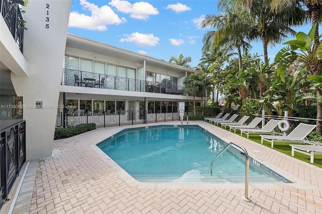 view of swimming pool with a patio area