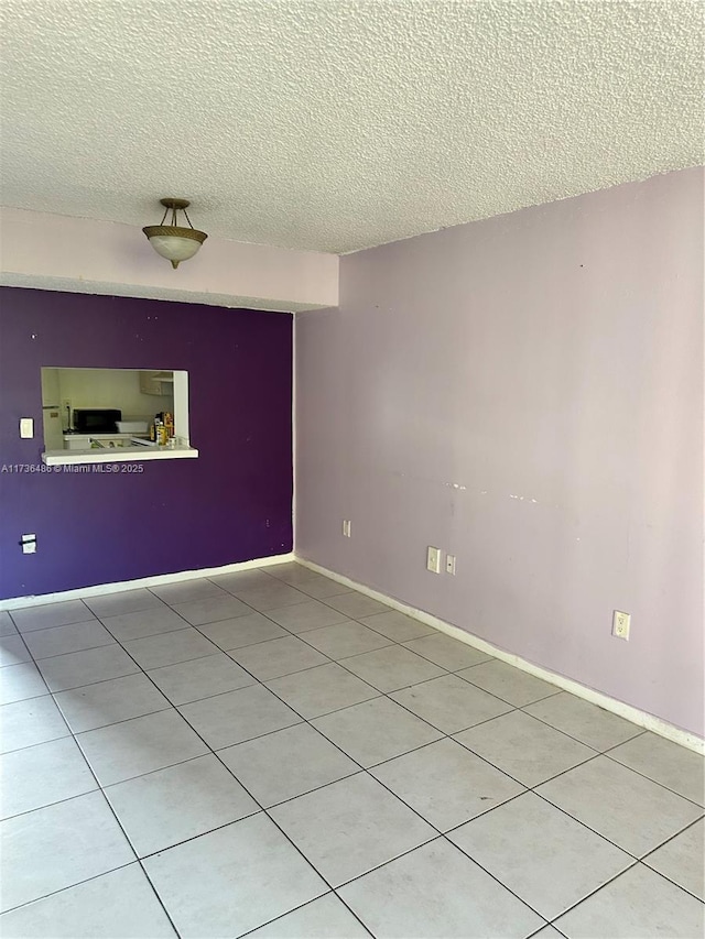 empty room featuring a textured ceiling