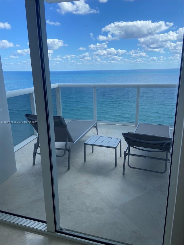 balcony featuring a water view