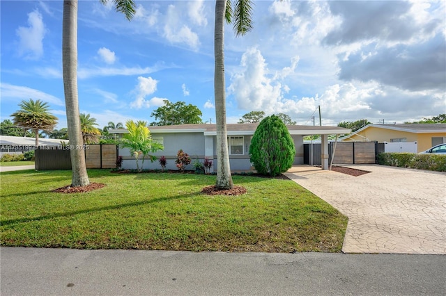 1498 NE 39th St, Oakland Park, FL 33334 - ranch-style house with decorative driveway and stucco siding
