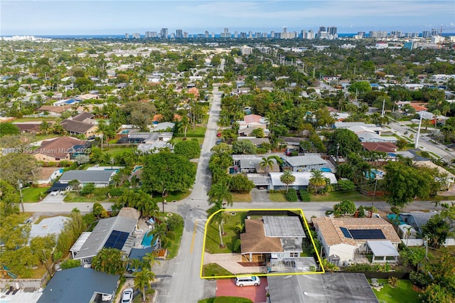 1498 NE 39th St, Oakland Park, FL 33334 - aerial view of property and surrounding area with property parcel outlined, city skyline, and nearby suburban area
