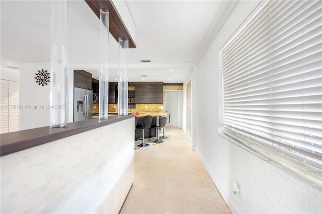 1498 NE 39th St, Oakland Park, FL 33334 - hallway with a textured ceiling and baseboards