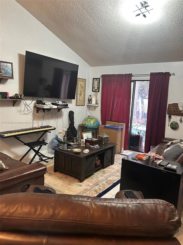 living room featuring lofted ceiling and a textured ceiling