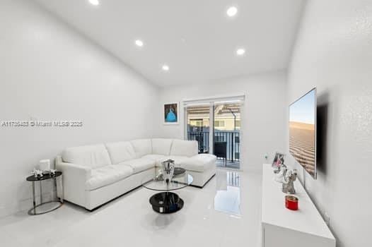 living room featuring lofted ceiling