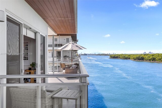 balcony featuring a water view