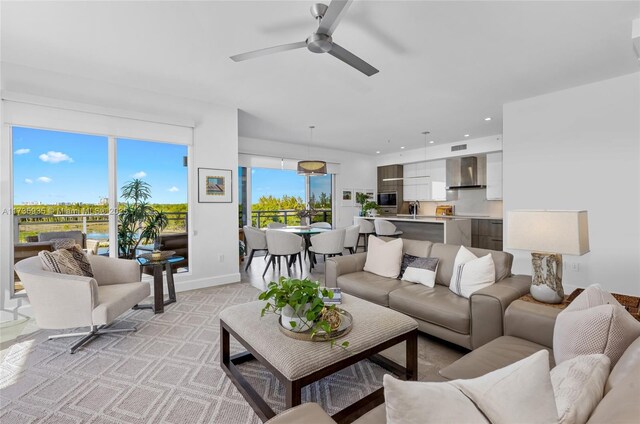 living room with sink and ceiling fan