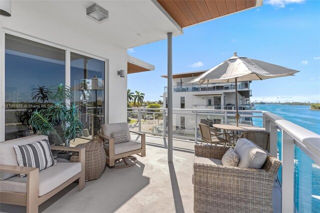 balcony featuring a water view