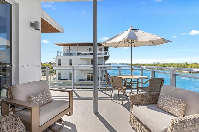 balcony featuring a water view