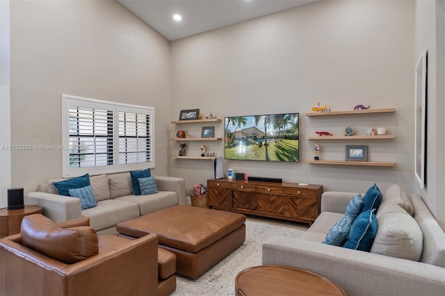 living room featuring a high ceiling