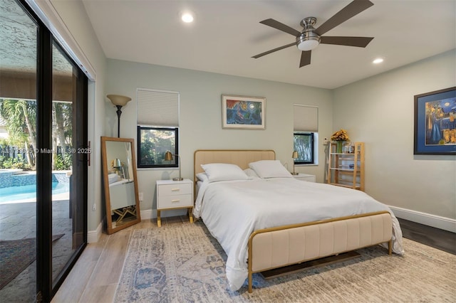 bedroom with access to exterior, hardwood / wood-style floors, and ceiling fan