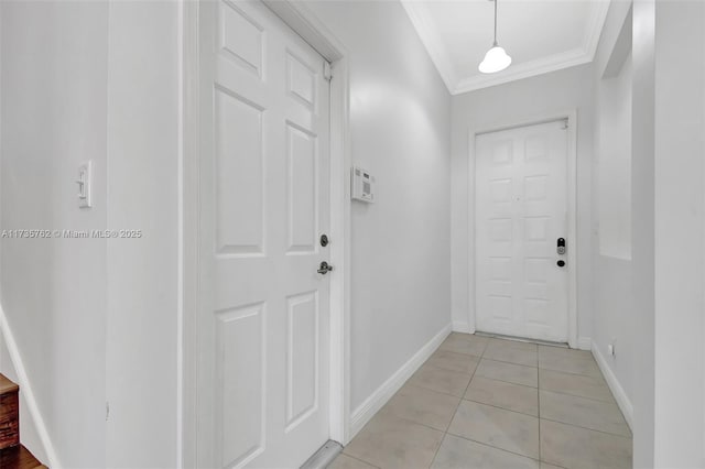 doorway with crown molding and light tile patterned flooring