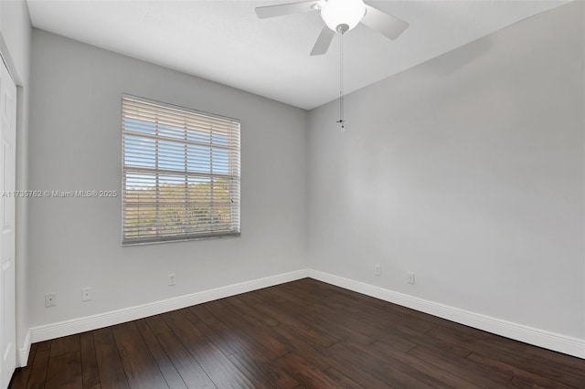 empty room with ceiling fan and wood-type flooring