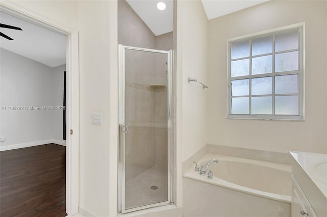 bathroom featuring vanity, ceiling fan, hardwood / wood-style flooring, and separate shower and tub