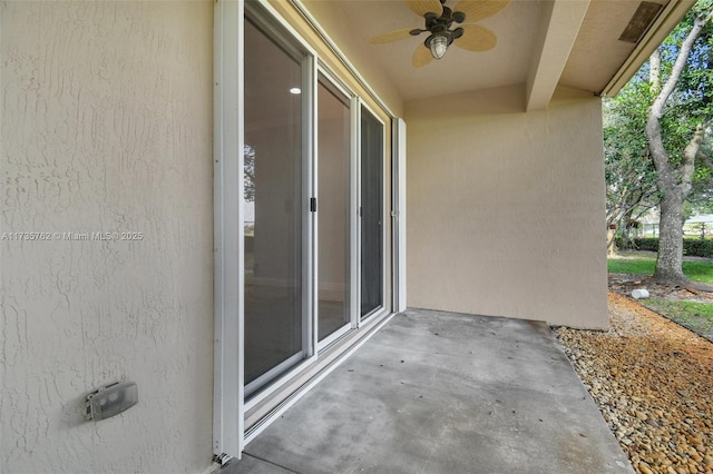 view of patio featuring ceiling fan