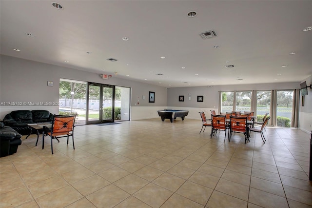 tiled dining room with a healthy amount of sunlight and pool table