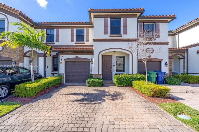 mediterranean / spanish-style home featuring a garage