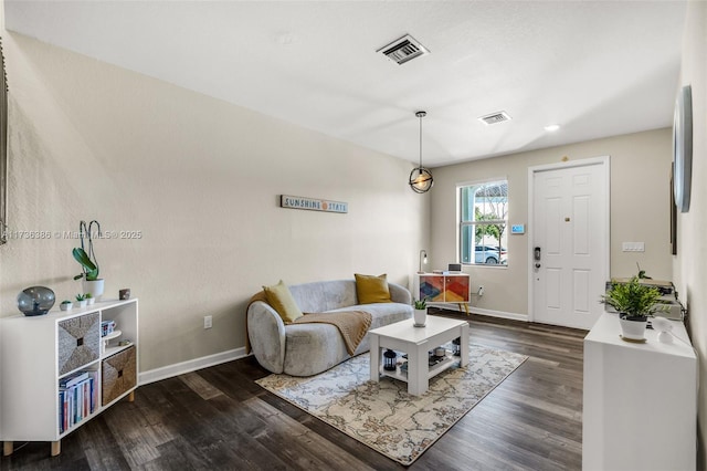 living room featuring dark hardwood / wood-style floors