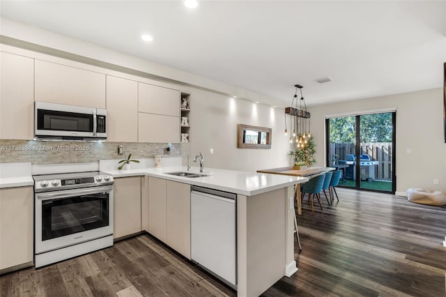 18330 NW 91st Ct Unit 18330, Hialeah, FL 33018 - kitchen with stainless steel appliances, open shelves, a sink, recessed lighting, and light countertops