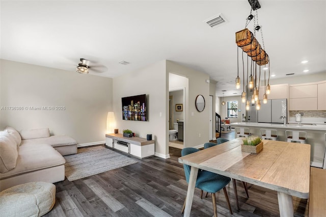18330 NW 91st Ct Unit 18330, Hialeah, FL 33018 - dining space with dark wood finished floors, baseboards, recessed lighting, ceiling fan, and stairs