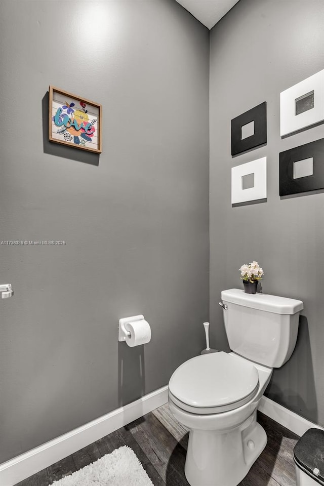 18330 NW 91st Ct Unit 18330, Hialeah, FL 33018 - bathroom with baseboards, toilet, and wood finished floors
