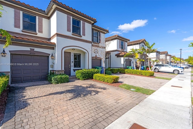 18330 NW 91st Ct Unit 18330, Hialeah, FL 33018 - multi unit property featuring a tile roof, decorative driveway, an attached garage, and stucco siding