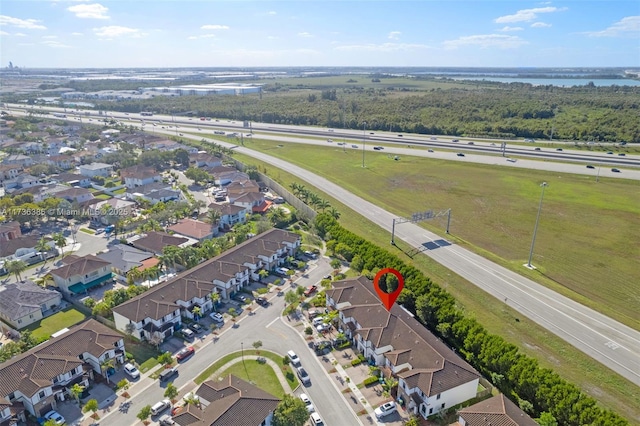 18330 NW 91st Ct Unit 18330, Hialeah, FL 33018 - aerial perspective of suburban area featuring a main thoroughfare and a nearby body of water