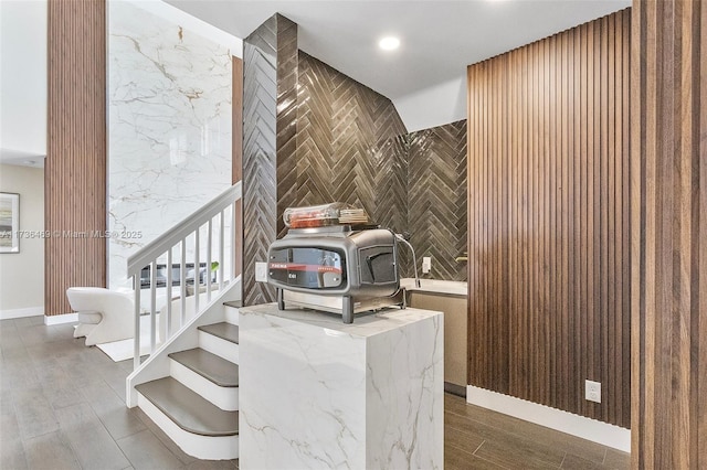 stairs featuring hardwood / wood-style flooring