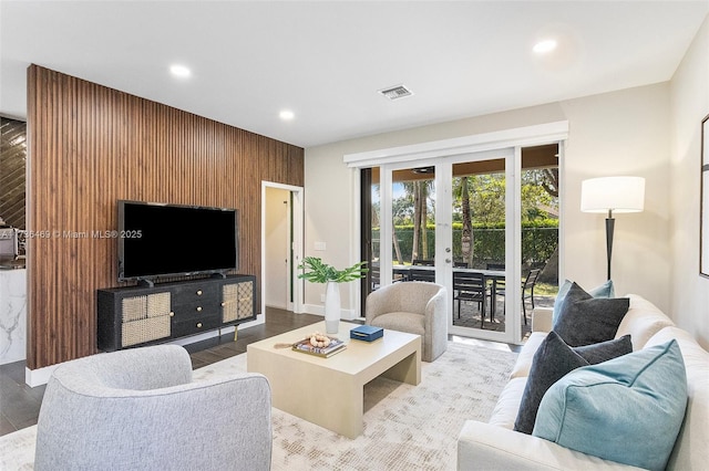 living room with french doors and light hardwood / wood-style flooring