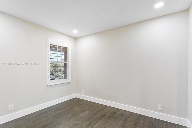 empty room featuring dark wood-type flooring