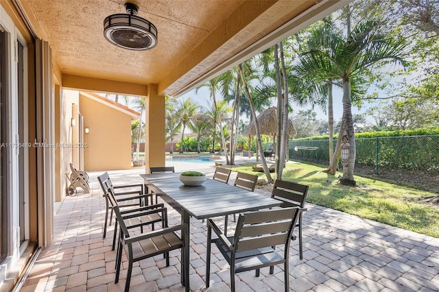 view of patio with a fenced in pool