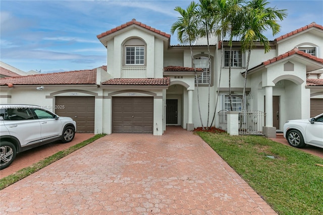 mediterranean / spanish-style home featuring a garage