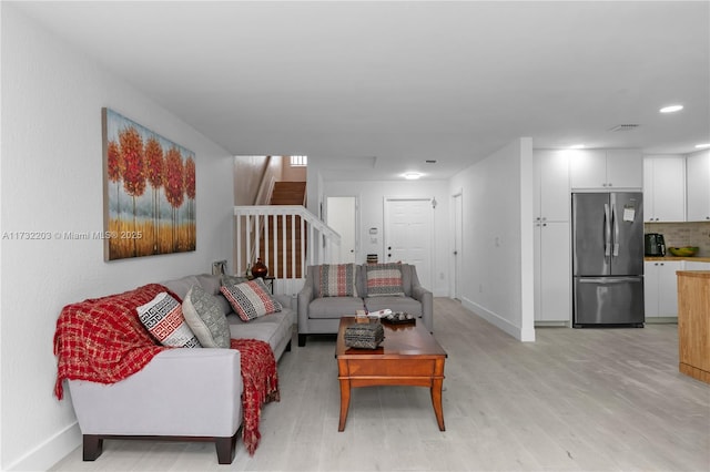 living room with light hardwood / wood-style floors