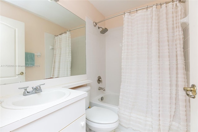 full bathroom with shower / bath combination with curtain, vanity, and toilet