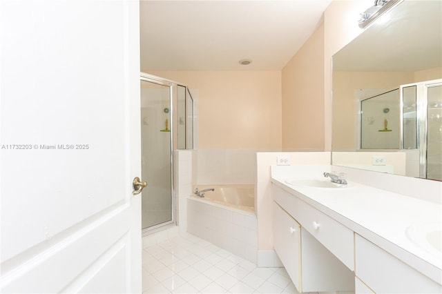 bathroom featuring independent shower and bath, vanity, and tile patterned floors