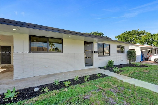 212 SW 11th Ave, Dania Beach, FL 33004 - view of front facade featuring brick siding