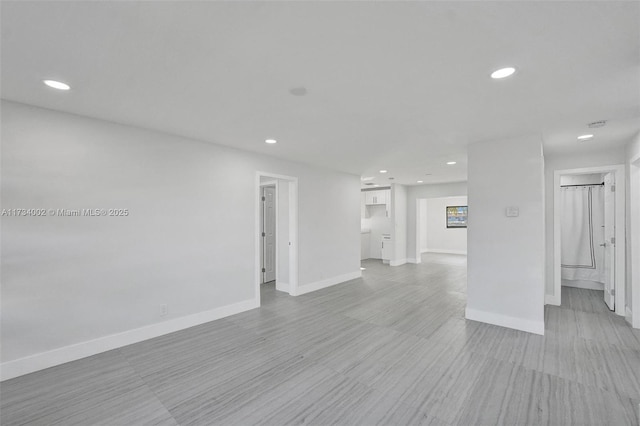 212 SW 11th Ave, Dania Beach, FL 33004 - unfurnished living room with recessed lighting and baseboards