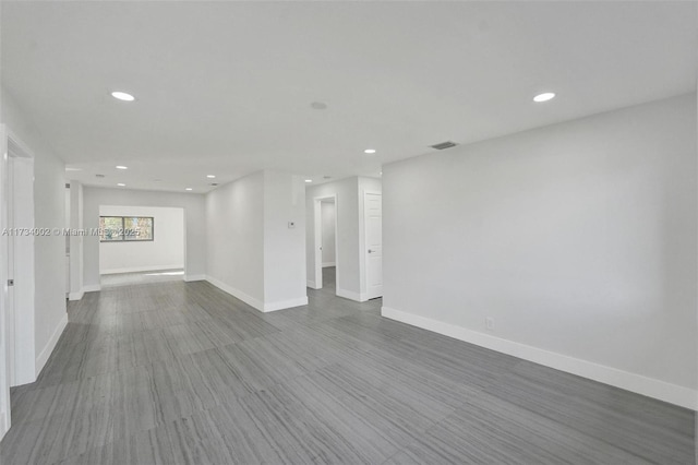 empty room with hardwood / wood-style flooring