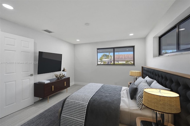 bedroom with light hardwood / wood-style flooring