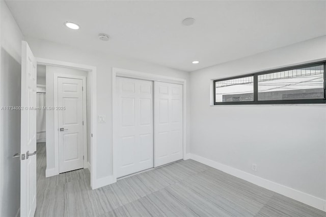 unfurnished bedroom featuring a closet