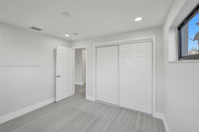 unfurnished bedroom featuring a closet