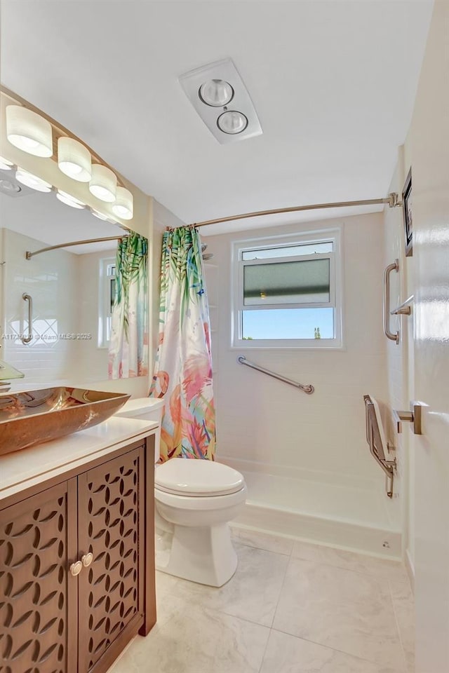 bathroom featuring vanity, toilet, and walk in shower