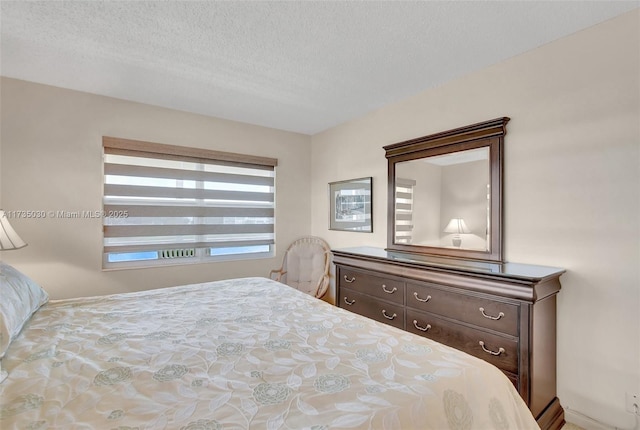 bedroom featuring a textured ceiling