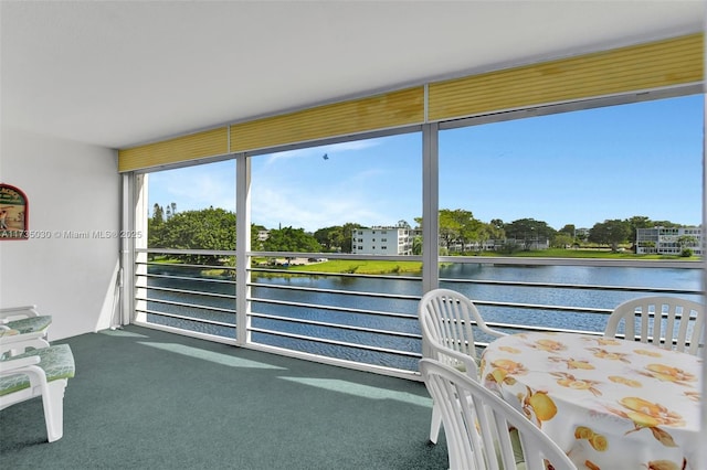 sunroom with a water view