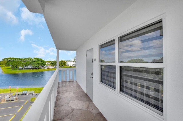 balcony featuring a water view