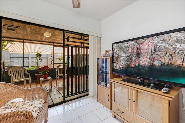 tiled living room with ceiling fan