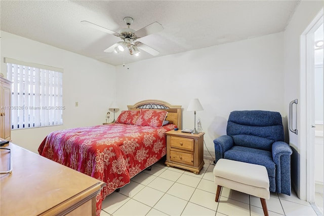 bedroom featuring ceiling fan, multiple windows, and light tile patterned floors