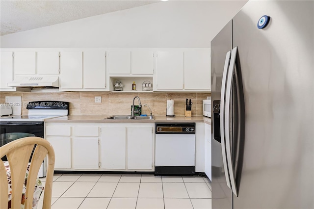 kitchen with white appliances, sink, decorative backsplash, and white cabinets