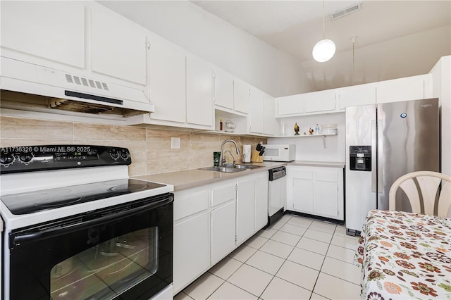 kitchen featuring white cabinetry, sink, decorative backsplash, light tile patterned floors, and white appliances