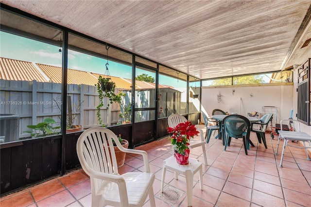 sunroom featuring wood ceiling